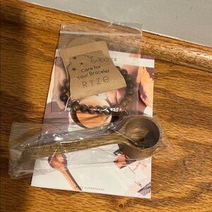 RYZE Bracelet Wooden Spoon and receipt book